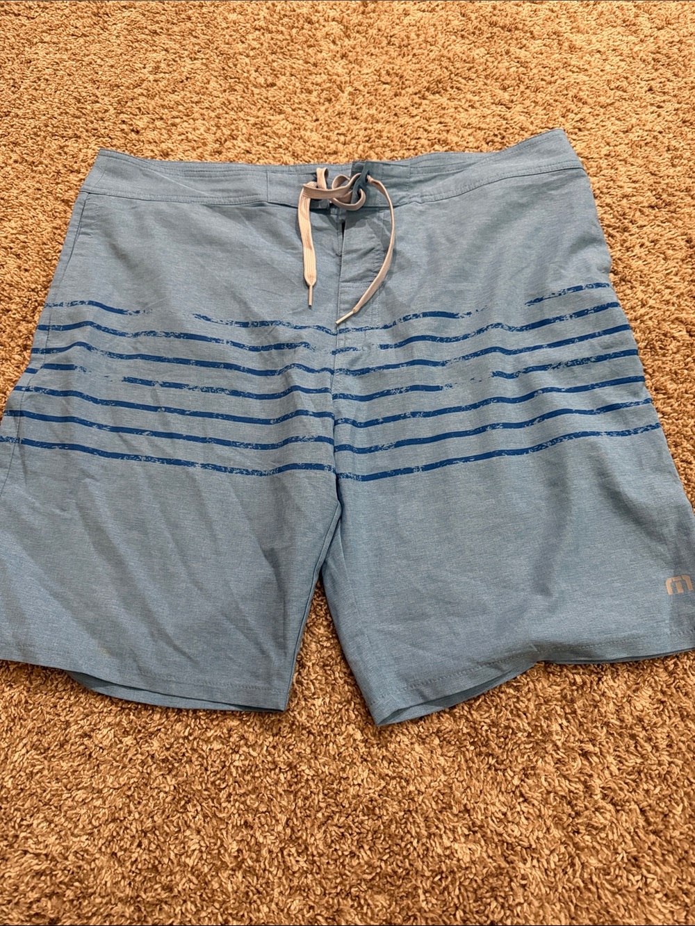 Travis Mathew Sky Blue Swim Trunks with Navy Stripe Accent